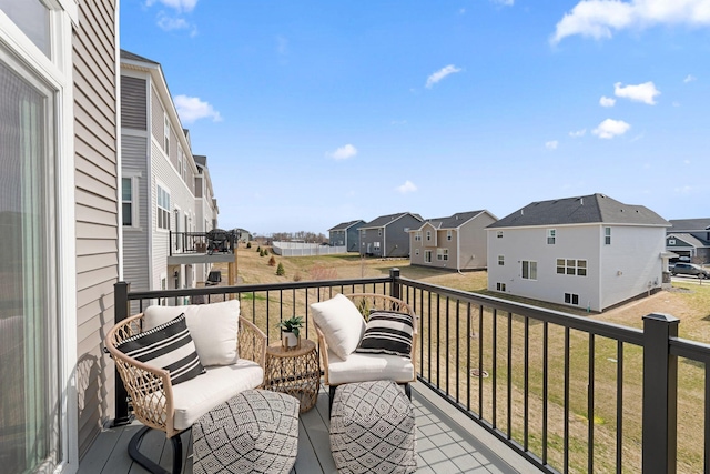 balcony featuring an outdoor living space and a residential view