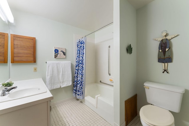 full bathroom featuring toilet, tile patterned floors, baseboards, and vanity