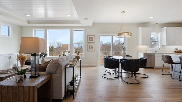2009 Lusitano St, Shakopee, MN 55379 - living area with light wood finished floors, a tray ceiling, and recessed lighting