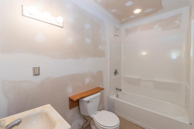 full bathroom featuring toilet, a sink, and tub / shower combination
