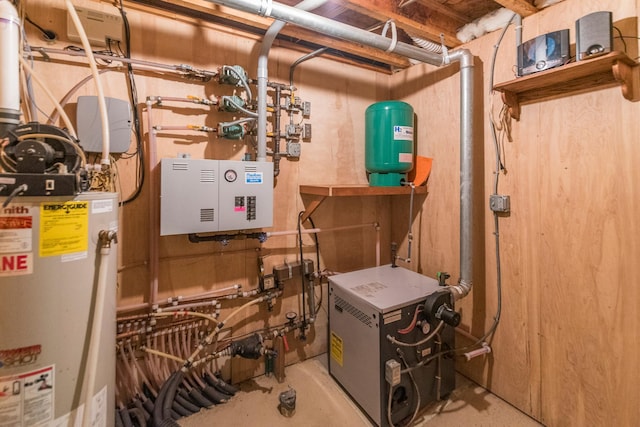 utility room with water heater and a heating unit