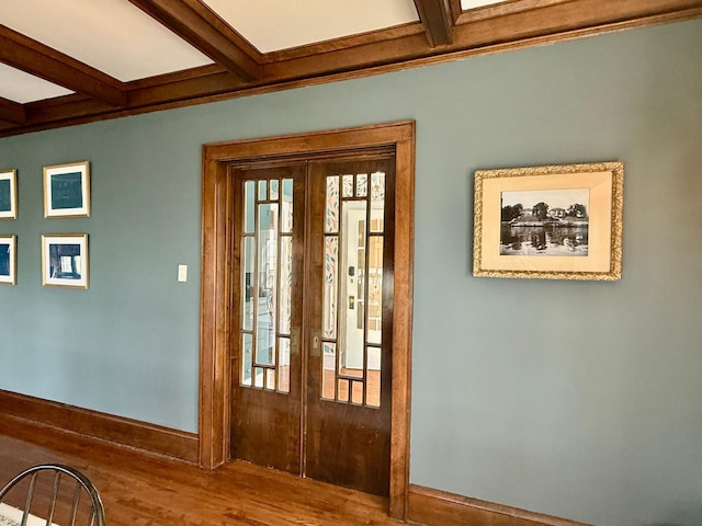 entryway with french doors, baseboards, beam ceiling, wood finished floors, and coffered ceiling