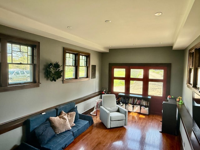 living room with wood finished floors and recessed lighting