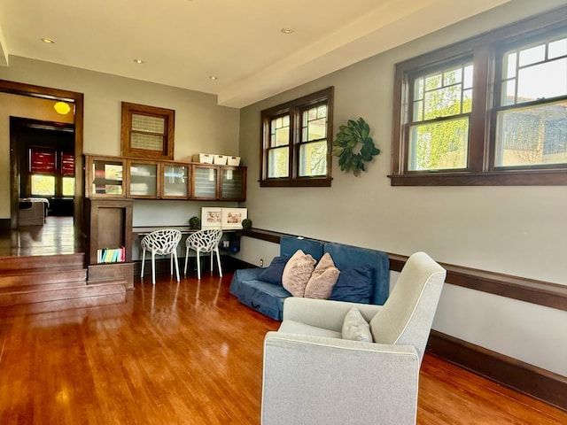 sitting room with wood finished floors and recessed lighting