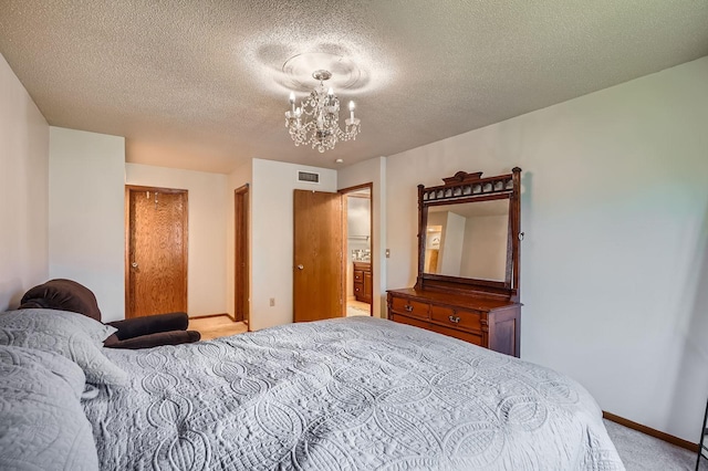 456 Ridge Ct, Chaska, MN 55318 - carpeted bedroom with a chandelier, a textured ceiling, and baseboards