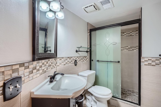 456 Ridge Ct, Chaska, MN 55318 - bathroom with tile walls, a shower stall, toilet, and vanity