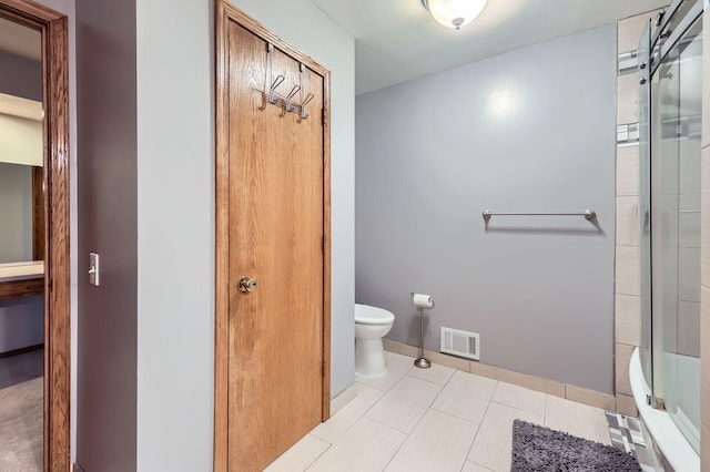 456 Ridge Ct, Chaska, MN 55318 - bathroom featuring toilet, baseboards, and tile patterned flooring