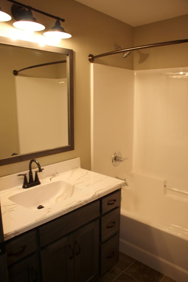 full bath featuring vanity, tub / shower combination, and tile patterned floors