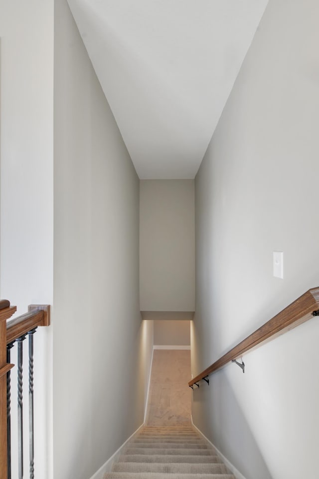 staircase with carpet flooring and baseboards