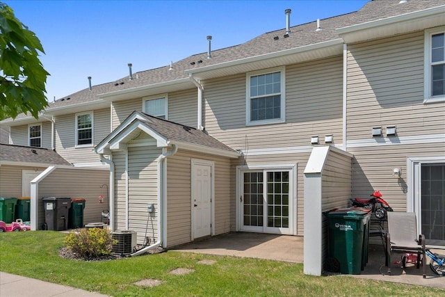 1960 Pika Trl Unit C, River Falls, WI 54022 - rear view of property with a patio area, a yard, and central AC