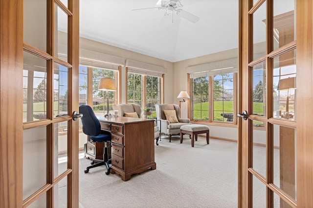 office area with french doors, light carpet, vaulted ceiling, ceiling fan, and baseboards