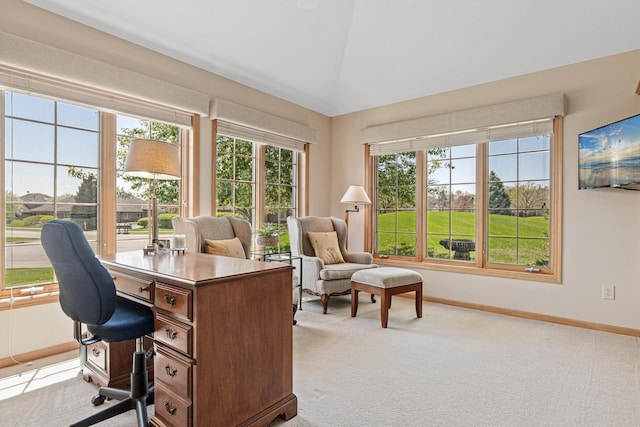 office area featuring baseboards, carpet flooring, healthy amount of natural light, and vaulted ceiling