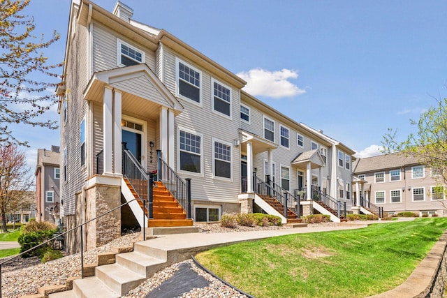 view of property with a residential view and a front yard