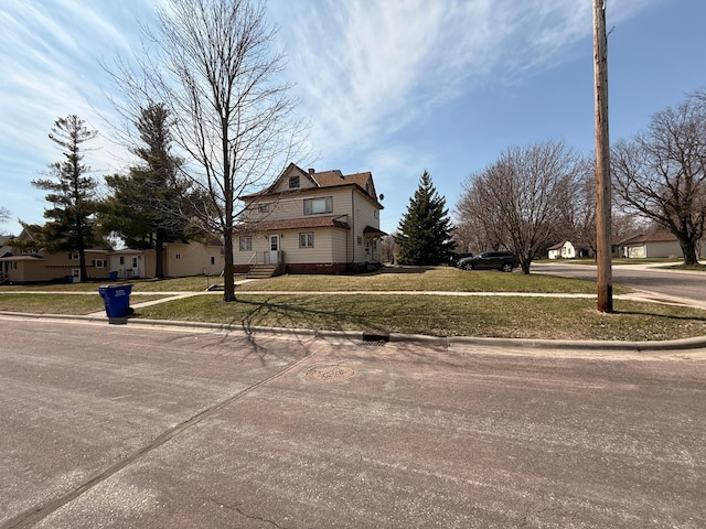 321 Western Ave, Madison, MN 56256 - view of home's exterior featuring a lawn