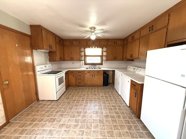 321 Western Ave, Madison, MN 56256 - kitchen featuring white appliances, washing machine and clothes dryer, brown cabinets, a sink, and light countertops