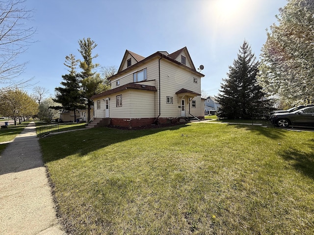 321 Western Ave, Madison, MN 56256 - view of side of property with a lawn and entry steps