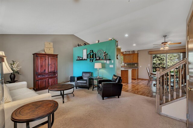 living area with light colored carpet, ceiling fan, lofted ceiling, and recessed lighting