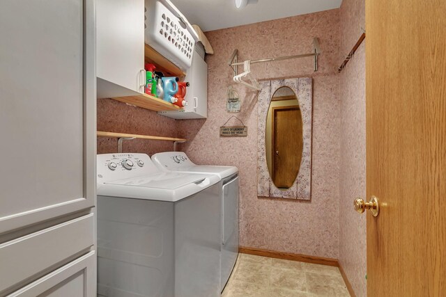 laundry room featuring washer and dryer and cabinet space