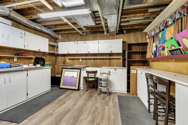 unfinished basement featuring light wood finished floors