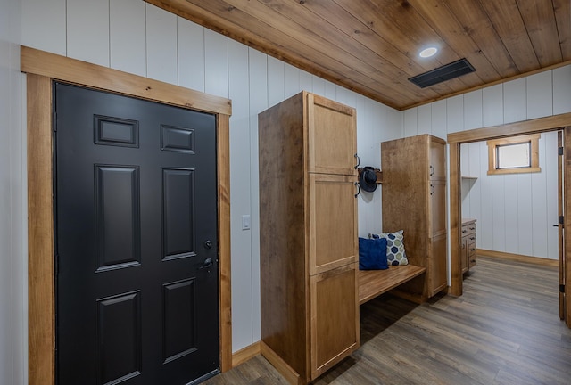 mudroom with wooden ceiling, wood finished floors, wooden walls, and baseboards