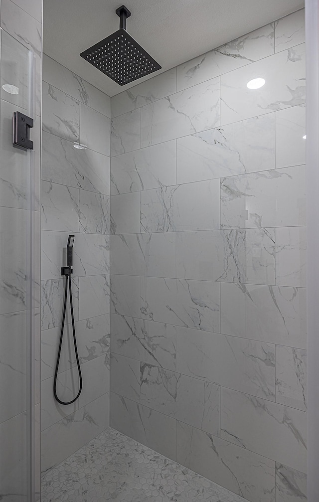 bathroom with a shower stall