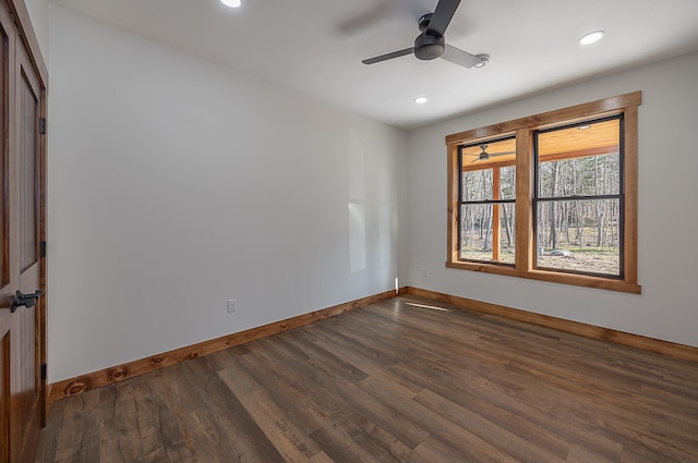 unfurnished room with baseboards, dark wood finished floors, a ceiling fan, and recessed lighting