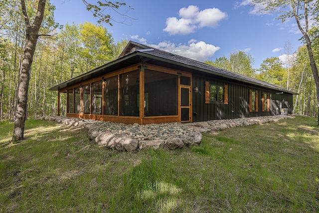 761 Ja Bird Loop NE, Longville, MN 56655 - view of side of property featuring a sunroom and board and batten siding