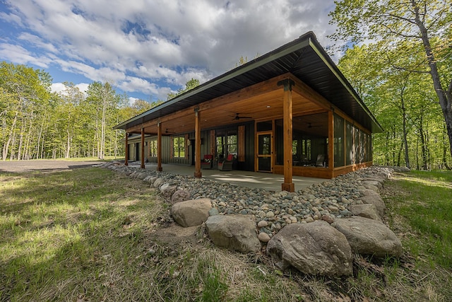 761 Ja Bird Loop NE, Longville, MN 56655 - rear view of property featuring a ceiling fan and a patio area