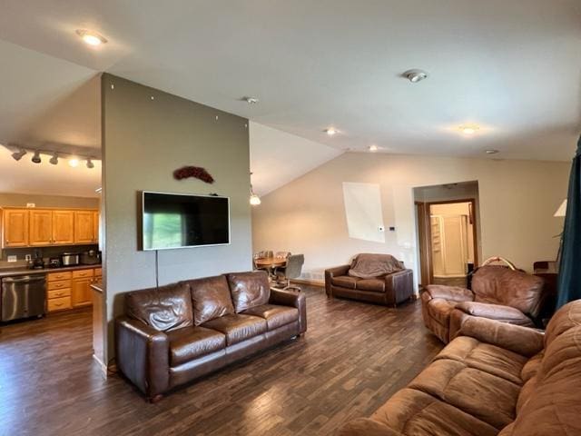 living room with dark wood-style flooring, track lighting, and vaulted ceiling