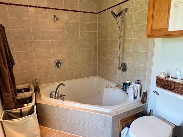full bath with tiled shower / bath combo and toilet
