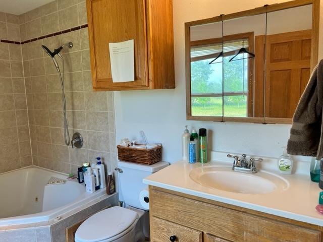 full bathroom with toilet, vanity, and a combined bath / shower with jetted tub