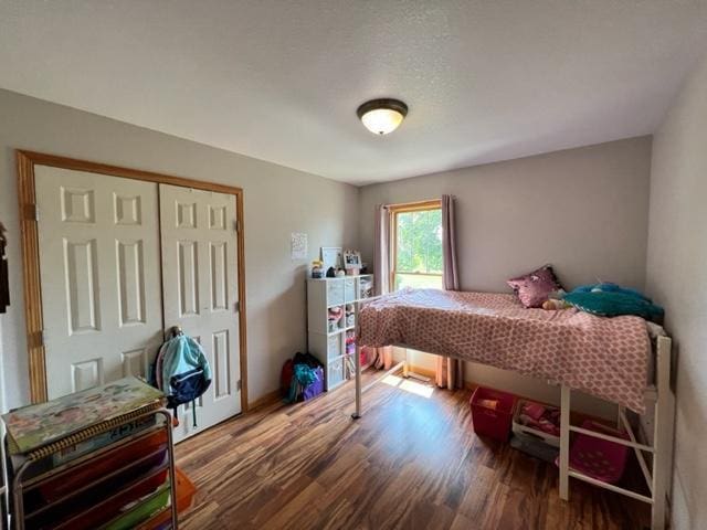 bedroom featuring a closet and wood finished floors