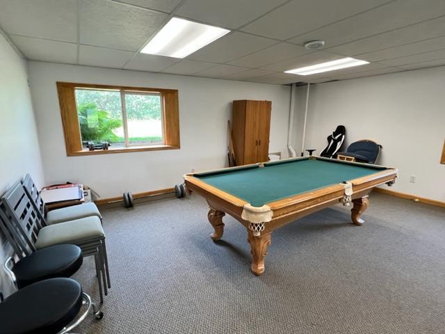 recreation room with a paneled ceiling, baseboards, pool table, and carpet floors