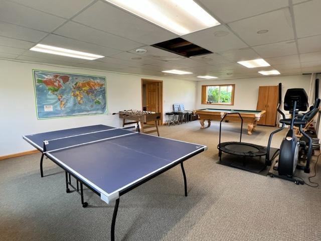 rec room featuring carpet, billiards, a drop ceiling, and baseboards