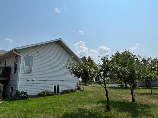view of property exterior featuring a yard