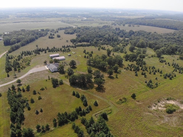 birds eye view of property featuring a rural view