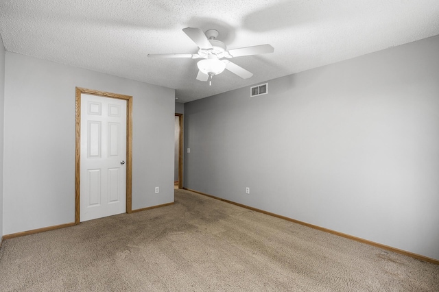 7327 Kalland Cir NE Unit 28, Otsego, MN 55301 - unfurnished bedroom featuring light carpet, baseboards, and ceiling fan