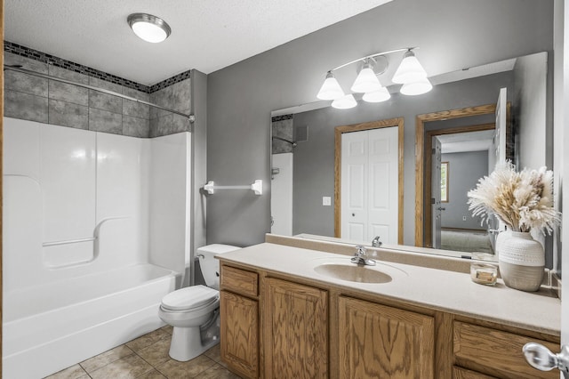 7327 Kalland Cir NE Unit 28, Otsego, MN 55301 - full bath featuring toilet, tile patterned floors, vanity, a textured ceiling, and shower / bathtub combination