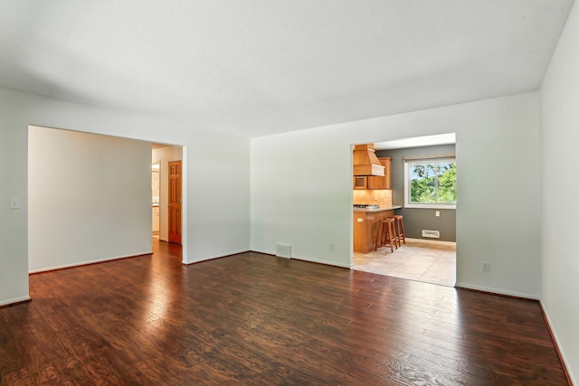 5820 139th St W, Apple Valley, MN 55124 - unfurnished living room featuring wood finished floors and baseboards