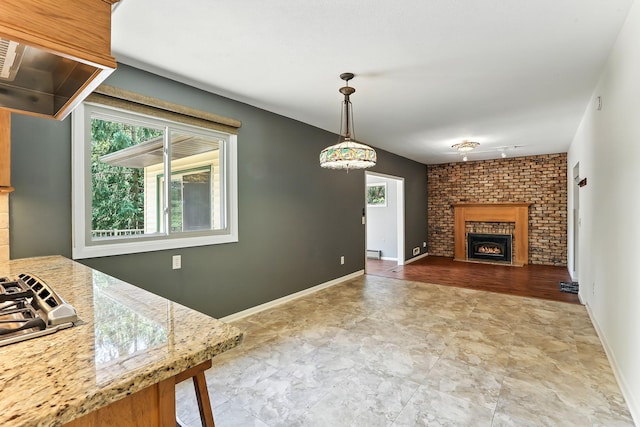 5820 139th St W, Apple Valley, MN 55124 - unfurnished living room with a fireplace and a baseboard heating unit