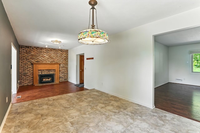 5820 139th St W, Apple Valley, MN 55124 - unfurnished living room featuring a fireplace and wood finished floors