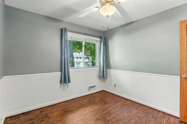 5820 139th St W, Apple Valley, MN 55124 - unfurnished room featuring wood finished floors, a ceiling fan, and wainscoting