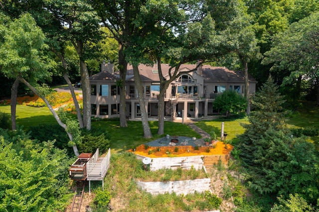 9002 Riley Lake Rd, Eden Prairie, MN 55347 - rear view of house with a lawn, stairway, and a deck