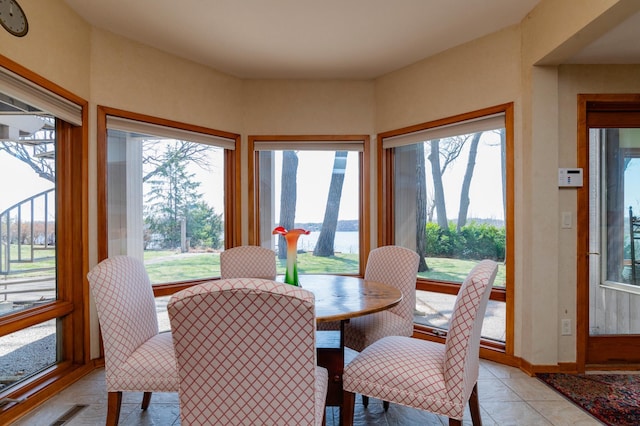 9002 Riley Lake Rd, Eden Prairie, MN 55347 - dining room with a water view and light tile patterned floors