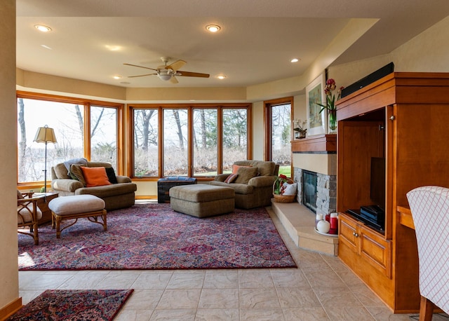 9002 Riley Lake Rd, Eden Prairie, MN 55347 - living area featuring ceiling fan, a glass covered fireplace, and recessed lighting