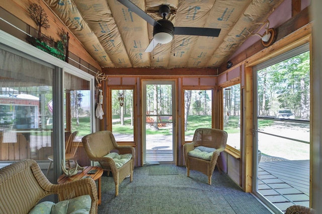 sunroom featuring a ceiling fan, plenty of natural light, and vaulted ceiling