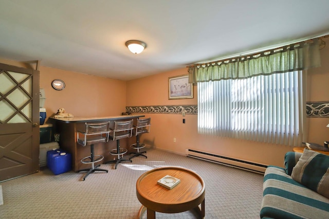indoor dry bar with carpet and a baseboard heating unit