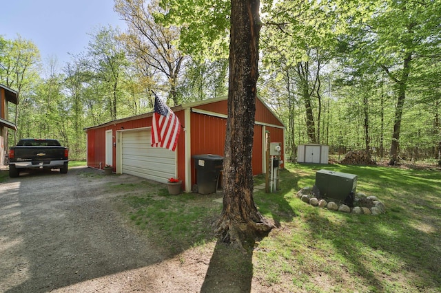 view of shed featuring driveway