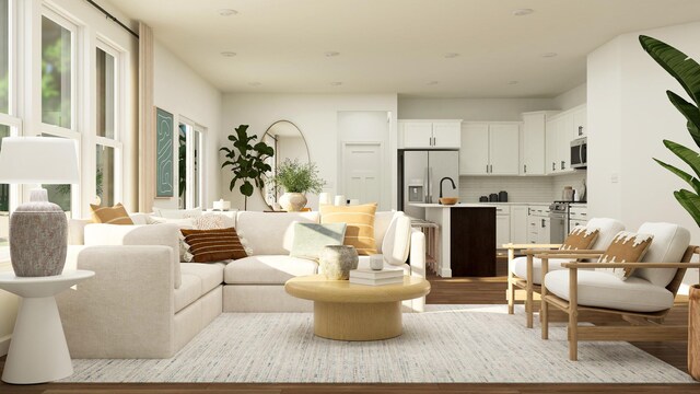 living room featuring plenty of natural light and wood finished floors