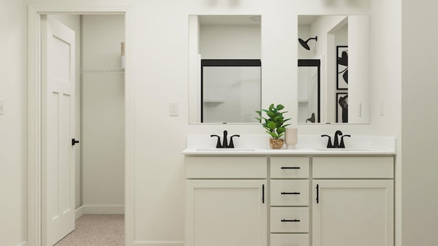 bathroom featuring double vanity and baseboards